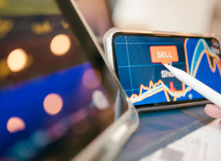 A trader reviewing Bitcoin, Ethereum, and forex options across multiple markets